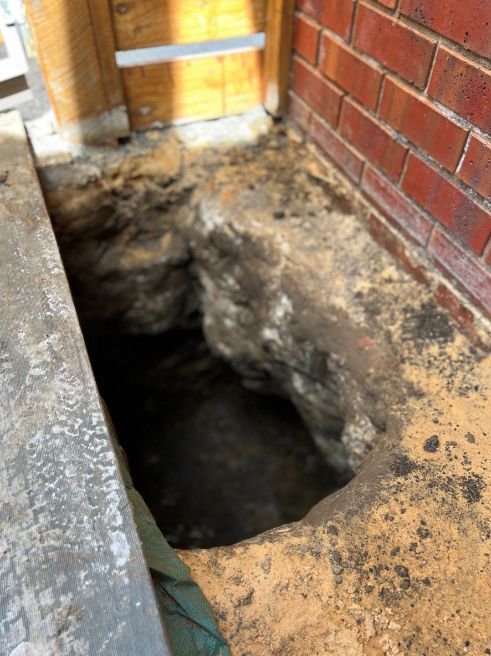 Restumping and underpinning contractors dug a hole to underpin in Golden Square